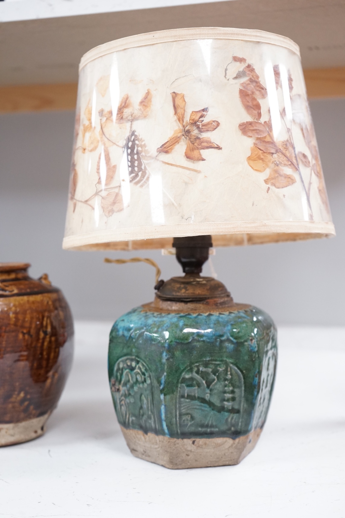 Two Chinese glazed pots, one converted as a lamp with a pressed floral shade, largest overall 37cm high